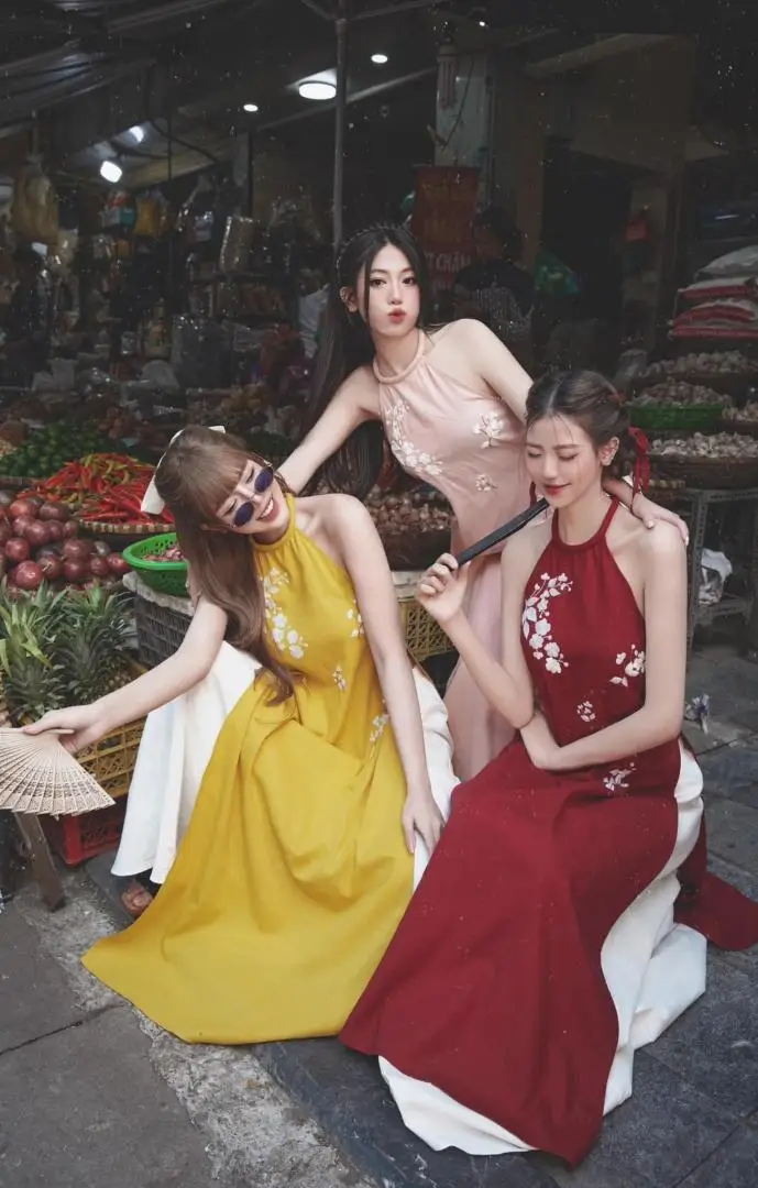 a group of women in dresses posing for a picture